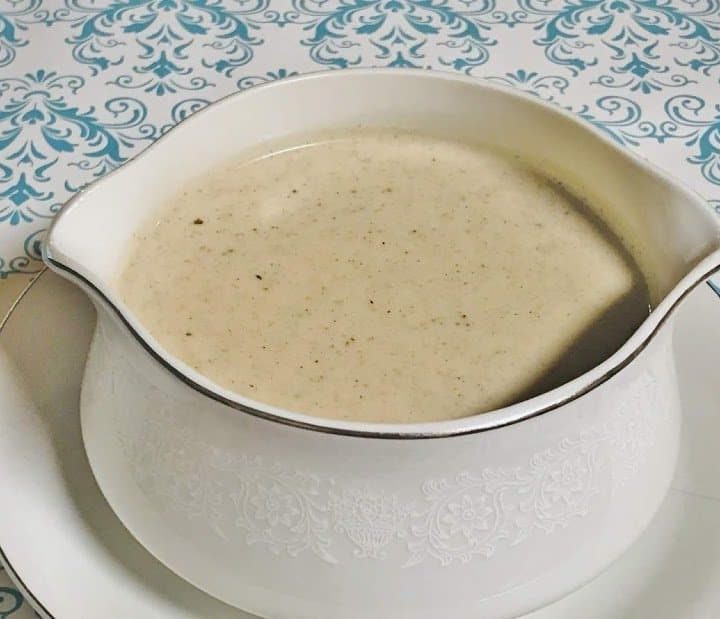 Creamy white gravy in a gravy bowl.