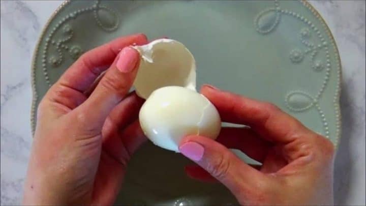 Peeling an easy to peel hard boiled egg.