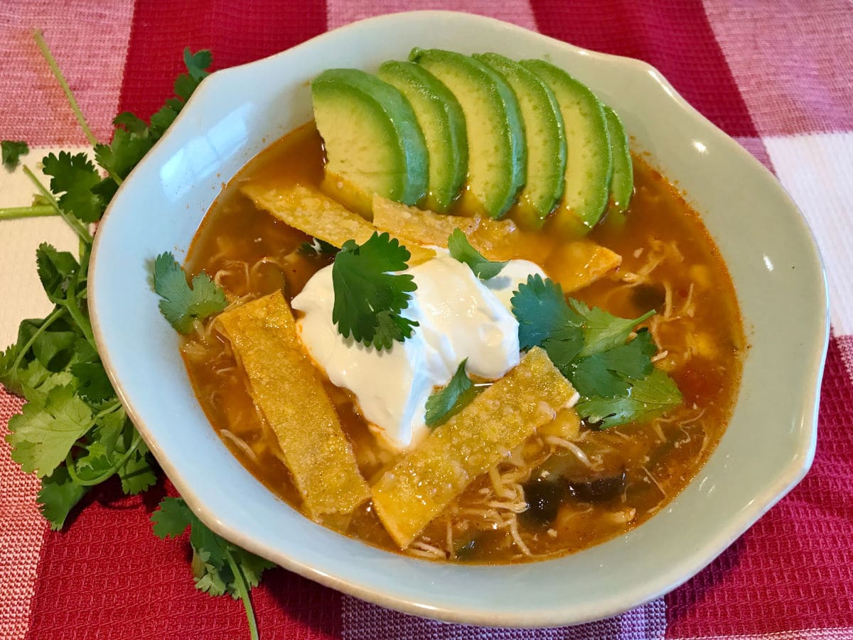 Chicken Tortilla Soup in a blue bowl.