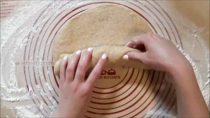 Rolling up bread dough into a loaf