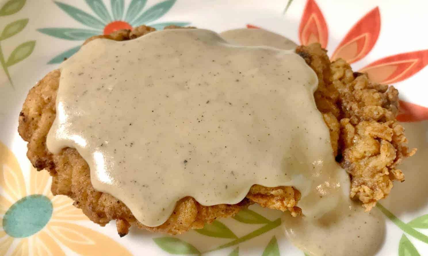 Southern Cream Gravy on top of country fried deer steak.