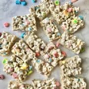 Lucky Charms Marshmallow Treats laying on a white marble counter top.
