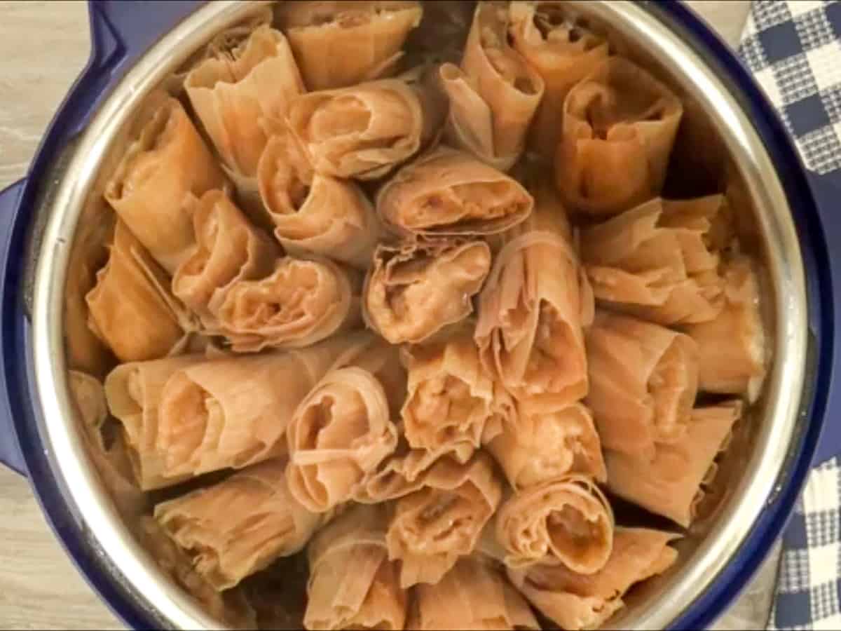 Cooked red chili sauce pork tamales in the Instant Pot.