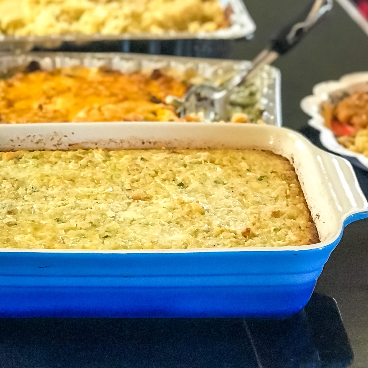 Cooked Chicken and Dressing in a casserole dish.