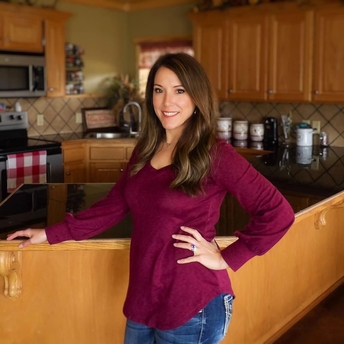 Christi, the owner and founder of Ranch Style Kitchen, standing in her own kitchen at home.