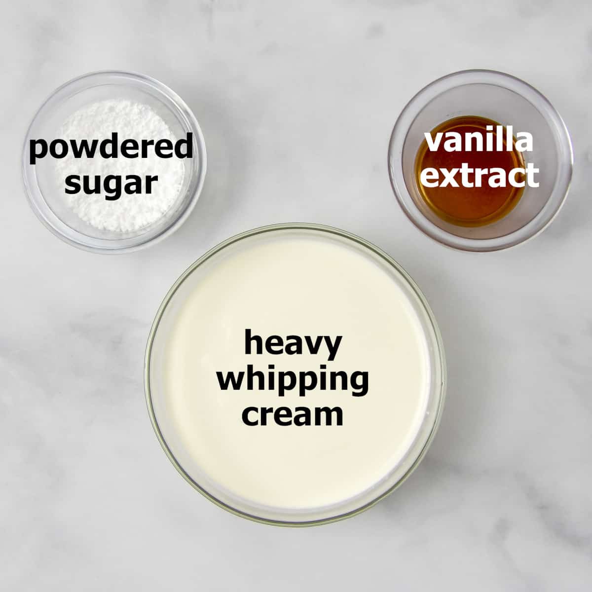 Ingredients for homemade whipped cream: heavy whipped cream, powdered sugar, and vanilla extract.
