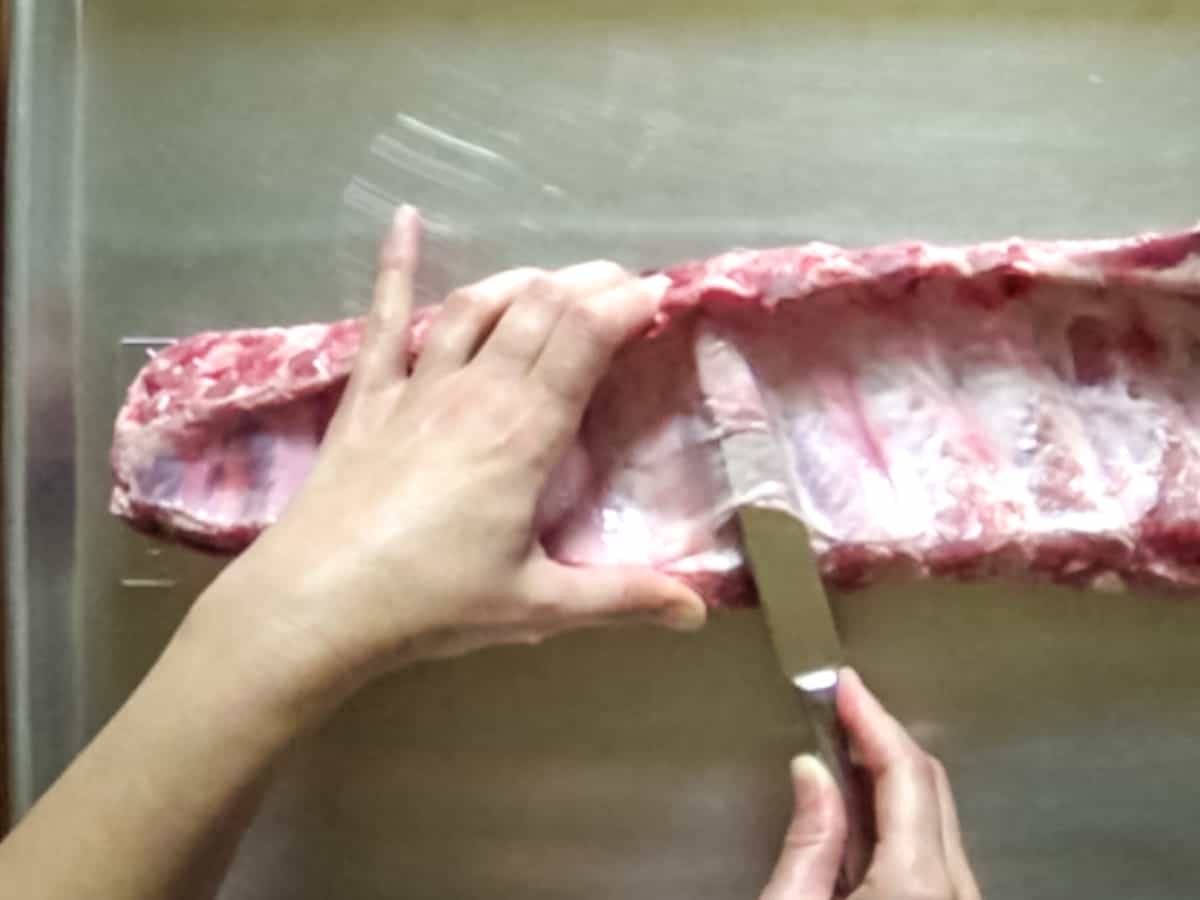 Removing the membrane (silver skin) from the boney side of baby back pork ribs.