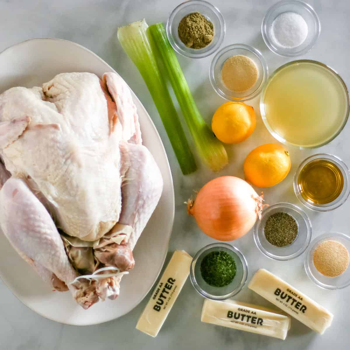 Baked turkey ingredients: whole turkey, butter, chicken broth, celery, onion, lemons, olive oil, sage, parsley, garlic powder, onion powder, salt, black pepper.
