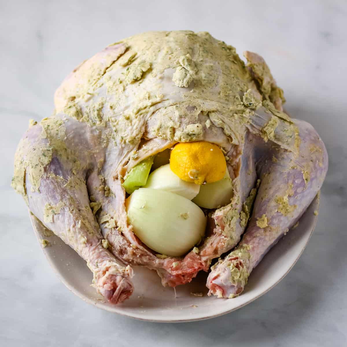 Lemons and an onion stuffed inside the turkey cavity.