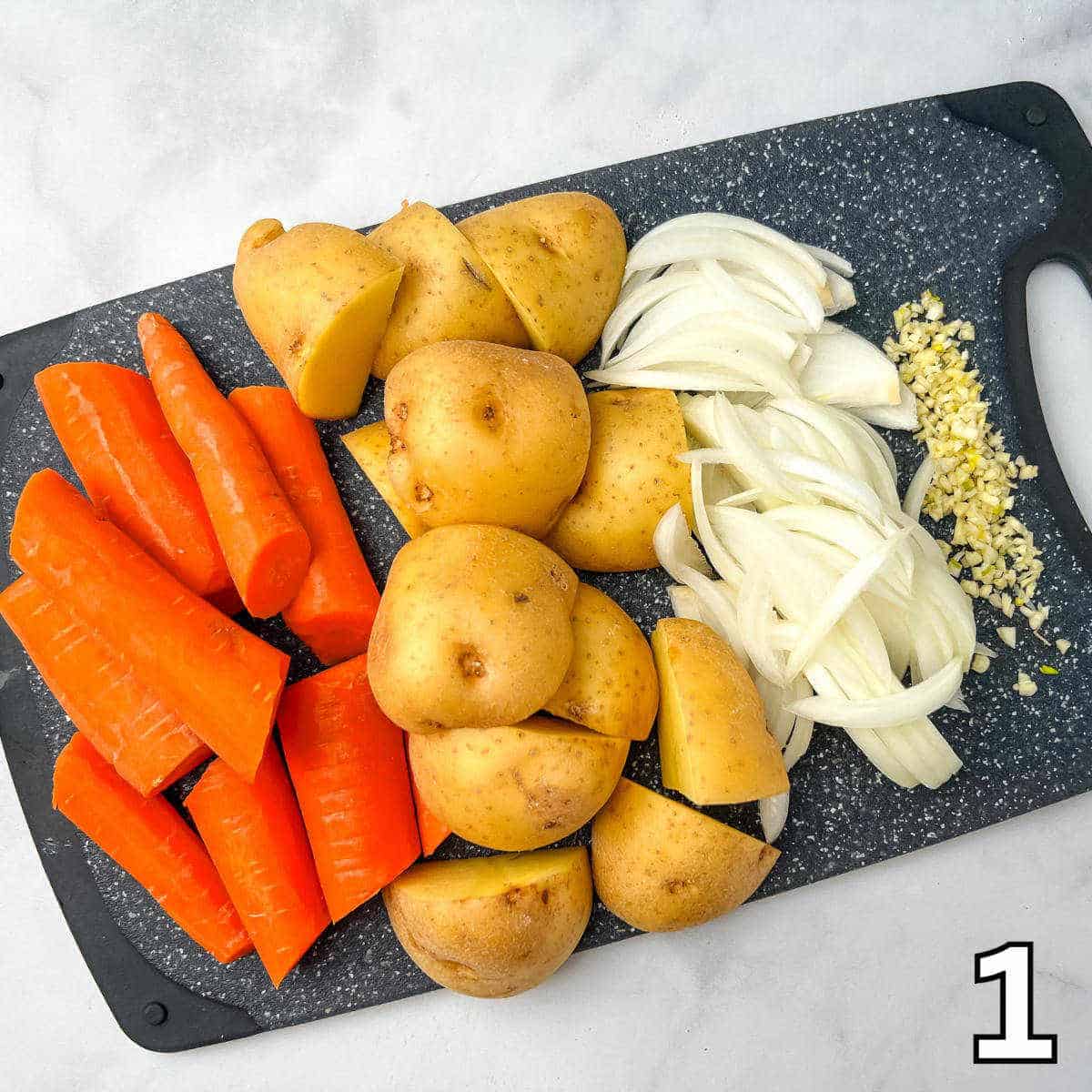 Preparing the vegetables to cook with the venison pot roast.